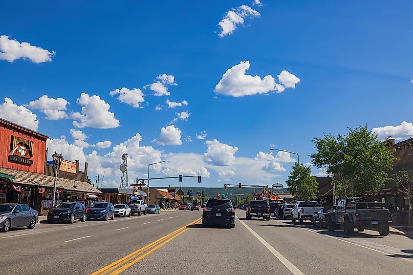 Street view in West Yellowstone, via Sign for Nacho Mamas, a Mexican restaurant, in the old historic ghost town, established 1864, via melissamn / Shutterstock.com