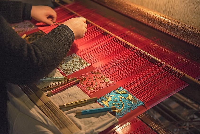 A woman weaving traditional chinese silk in Wuzhen, China