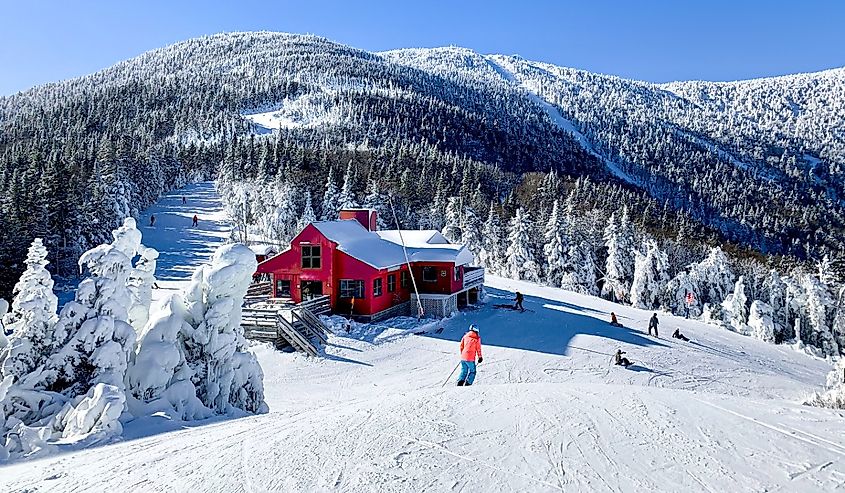 A red house in the middle of the white snow mountain. Sugarbush Ski Area, Vermont.