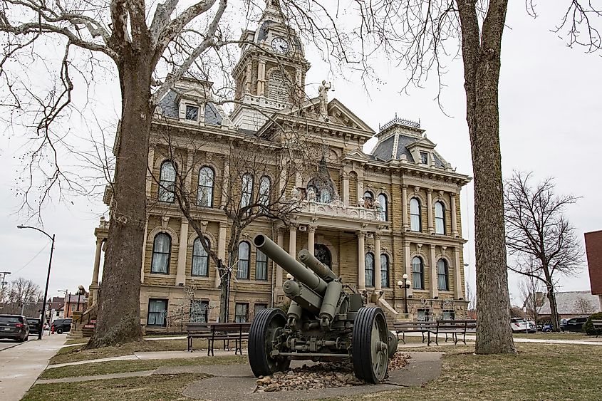 Historic Guernsey County Courthouse in downtown Cambridge, Ohio, featuring a prominent military gun display.