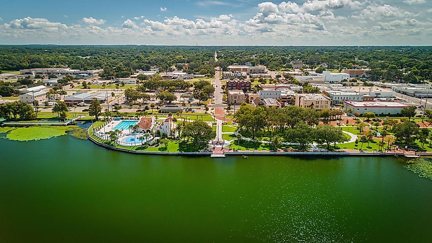 "Eustis, FL / USA - 8-20-2020: Drone view over Lake Eustis facing ferran park in downtown Eustis."