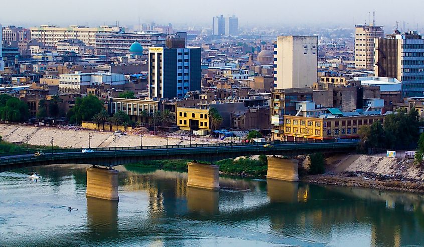 Aerial photo of the city of Baghdad, and shows where residential complexes and the Tigris River and bridge. and many of cars were passing.