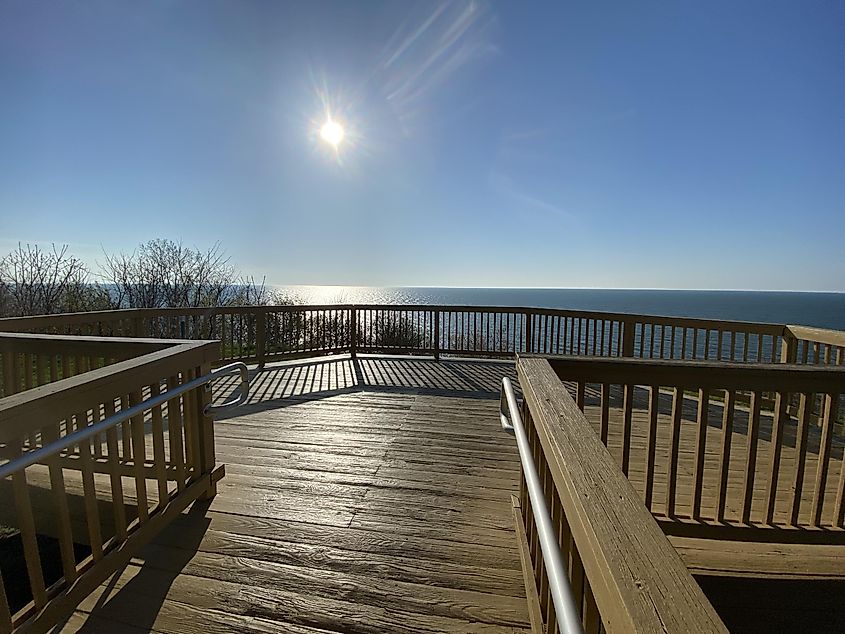 A spacious wooden deck on a hillside park. A perfect spot to watch the sun set