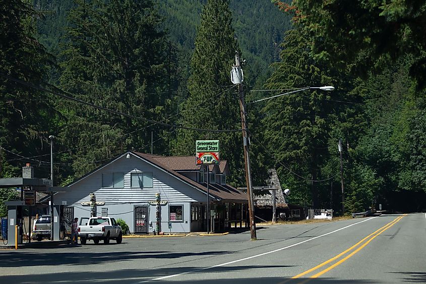 State Route 410 Chinook Scenic Byway passes the Greenwater General Store surrounded by Douglas fir forests