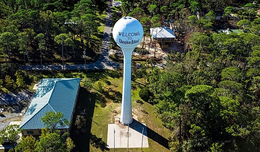 An aerial view of a welcome to Dauphin Island sign in Alabama