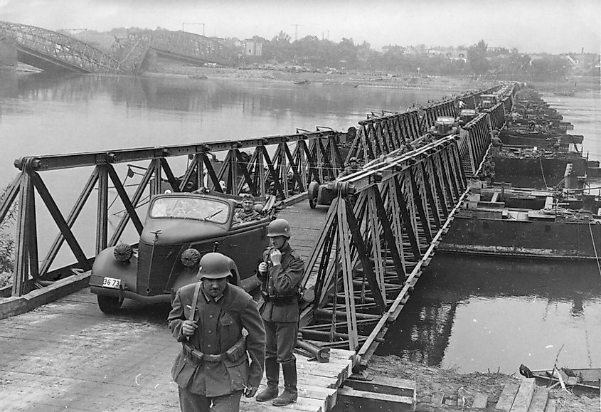 German army invades of Poland. Vehicles pass over a bridge constructed by German Army engineers crossing the Vistula River near Bydgoszcz, Poland. In the left is a destroyed bridge. Sept. 16, 1939