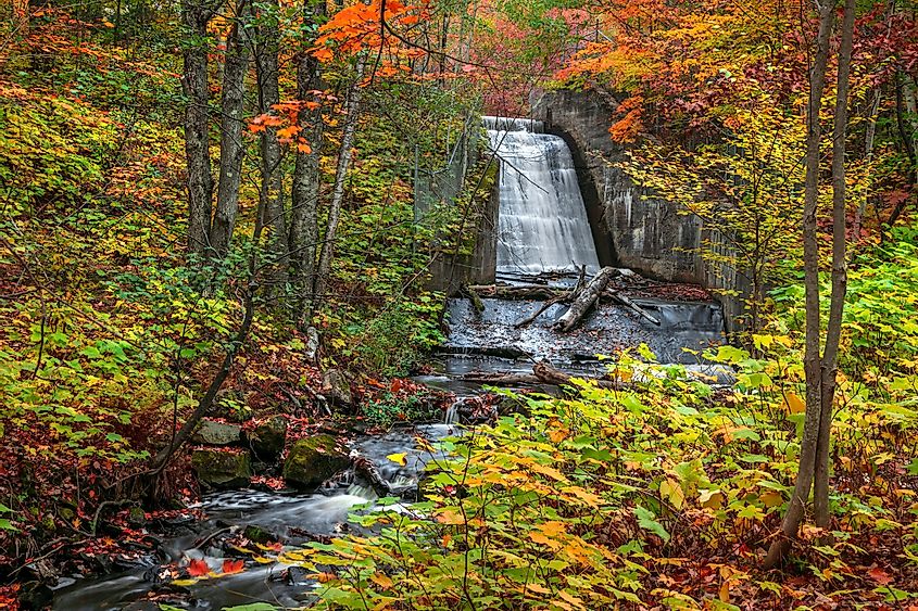 Lower Hungarian falls in Michigan upper peninsula near Hancock city surrounded by fall foliage