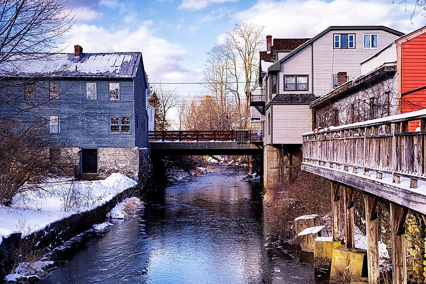 Old buildings lining the williams river running through the village of west stockbridge massachusetts