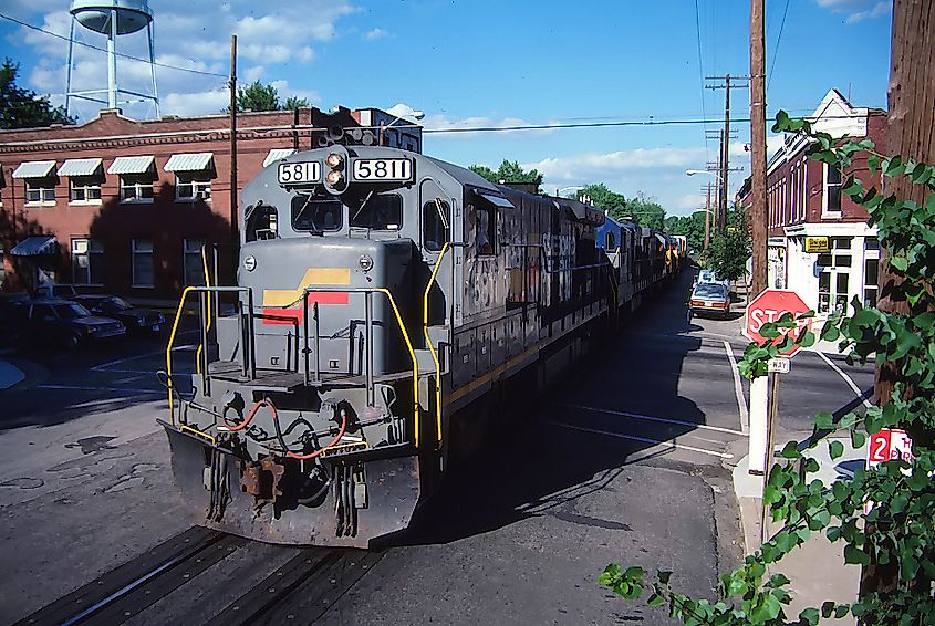 Train rolling westbound along Main Street in La Grange, Kentucky