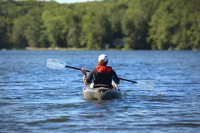 Kayak on a lake in Otis, Berkshire County, Massachusetts, with forested mountains in the background