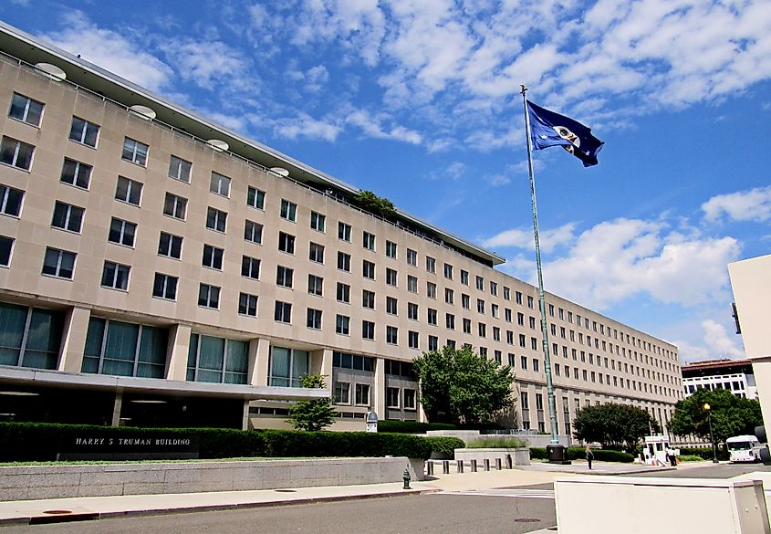 The U.S. Department of State flag flies over the Harry S. Truman Bldg. in Foggy Bottom. Via Shutterstock / Daniel J. Macy