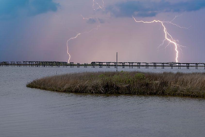 A storm cell and lightning over the salt marsh on Cape Hatteras National Seashore South of Nags Head North Carolina. Credit: Scott Evers/Shutterstock.com