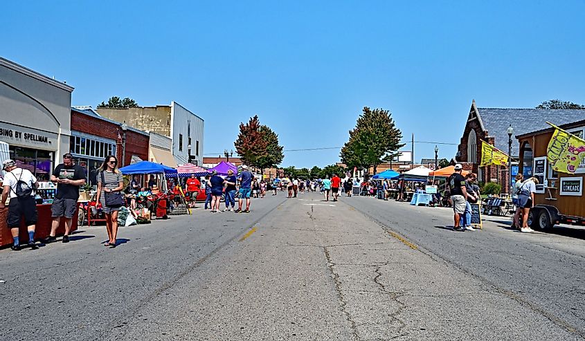People browse the booths set up along Commercial street in downtown today, Emporia, Kansas.