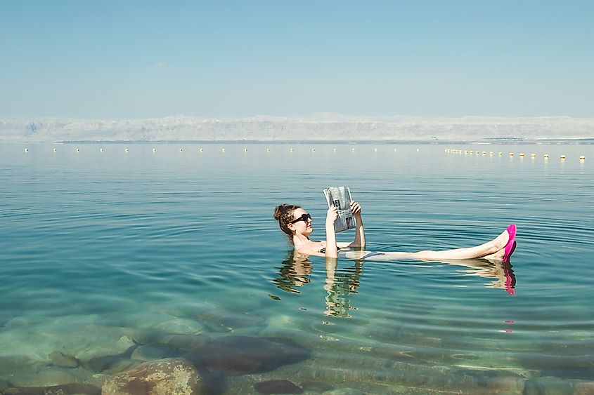 A person floating on the surface of the Dead Sea.