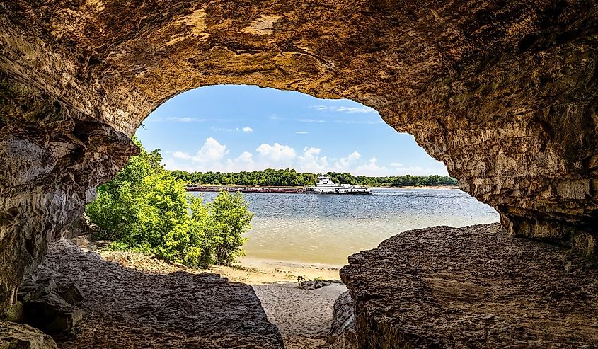 An Ohio River barge is viewed from Cave-In-Rock, a natural cavern and main attraction of its namesake Illinois state park. The cave, in a limestone bluff, is said to have been a pirates’ hideout.