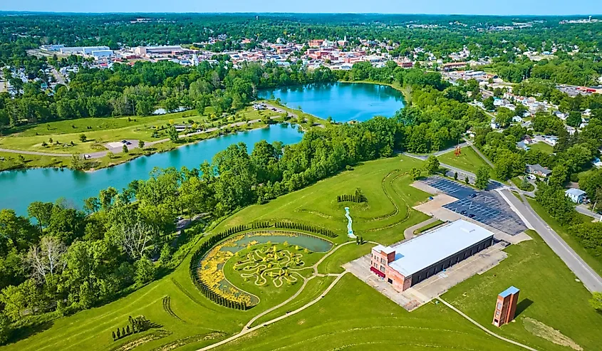 Turquoise pond water in distant summertime aerial over Mount Vernon and Ariel Foundation Park