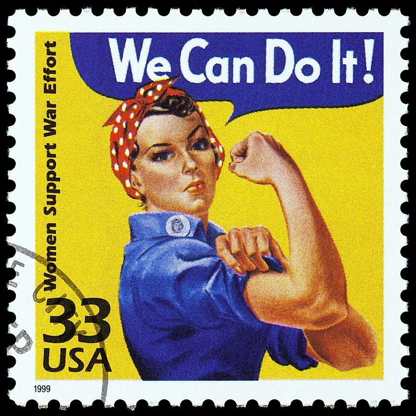 postage stamp showing an image of Rosie The Riveter commemorating the American woman who worked in factories during the World War