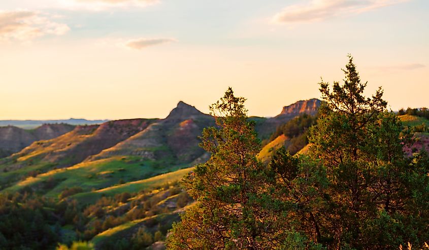 The sun sets over Scoria Point Overlook in Theodore Roosevelt National Park, North Dakota