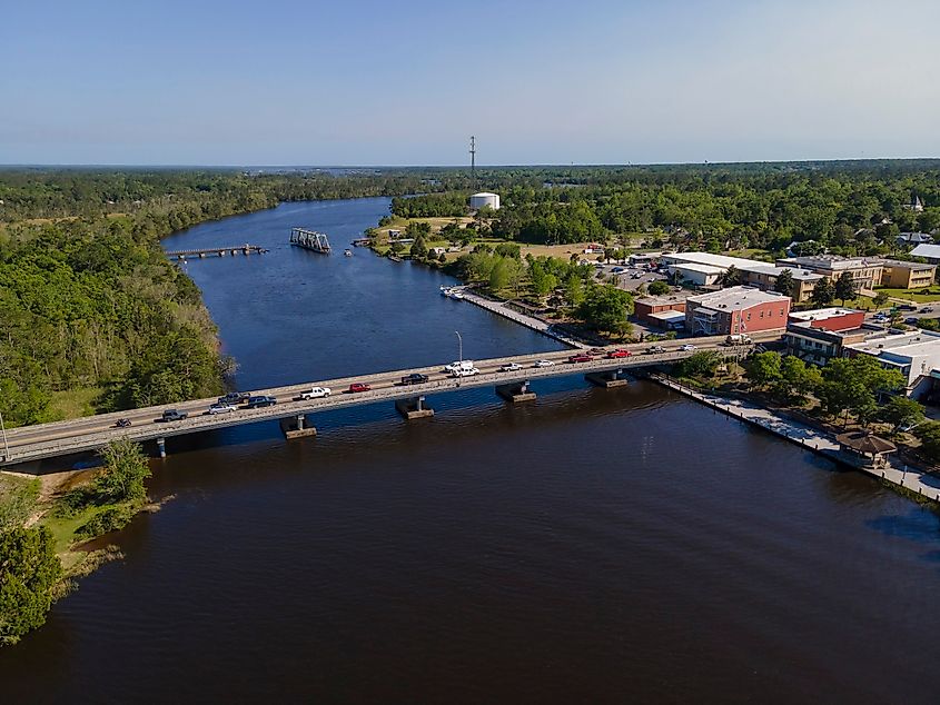 Aerial shot of highway bridge and swing bridge over the wide river at Milton, Florida.