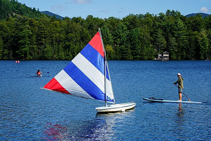 Water boarder enjoys summer day on Mirror Lake in Lake Placid, New York