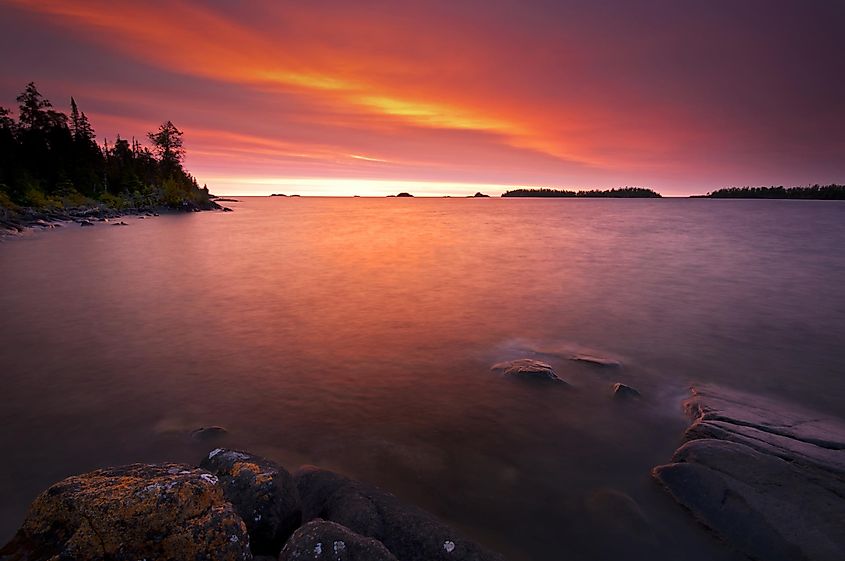 Rock Harbor Sunrise Sunrise colors reflect off the waters of Rock Harbor at Isle Royale National Park, Michigan.