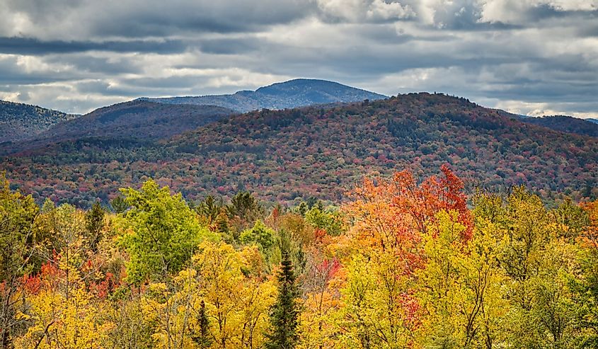 USA, New York, Adirondacks. Indian Lake, Fall foliage at overlook along Route 28