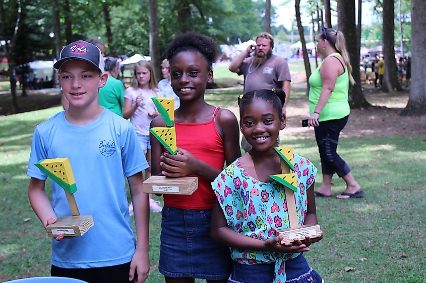 Winners of the Watermelon Olympics at the Yellow-Meated Watermelon Festival in Ashland, Alabama.