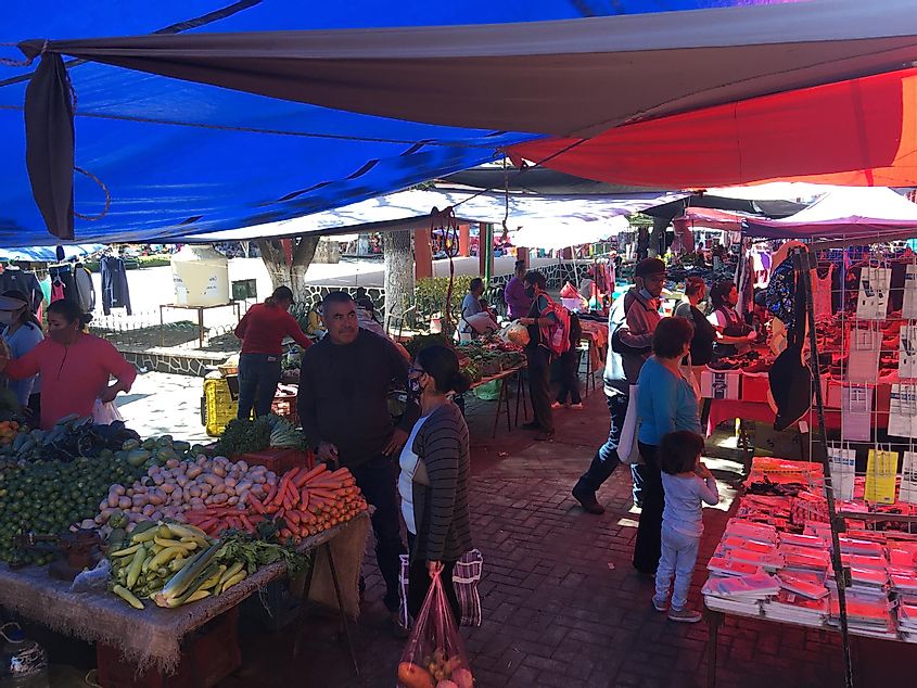 People shopping at a weekly pop-up market in a small Mexican town.