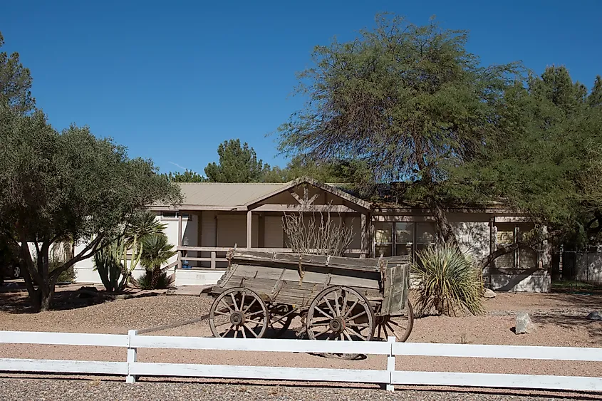 Rustic building and an old wagon in Eloy, Arizona.