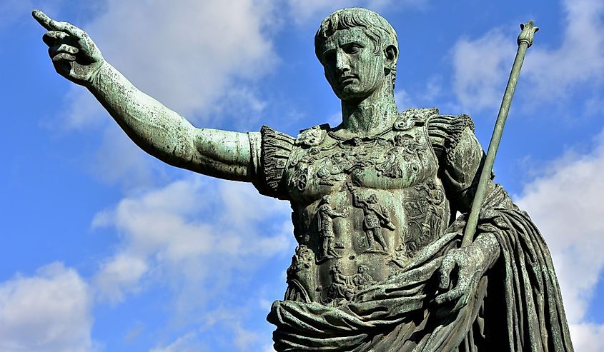 Caesar Augustus, the first emperor of Ancient Rome. Bronze monumental statue in the center of Rome, with beautiful sky