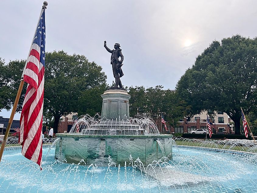 Lagrange, GA, United states - July 05 2023: Lafayette Fountain,This historic fountain is part of the downtown Lagrange scenery. Us flag on independence day.