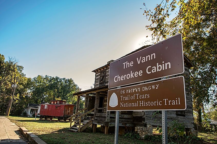 Sign in front of the historic Vann Cherokee Cabin in Cave Springs listed as a National Trail of Tears site. Editorial credit: JNix / Shutterstock.com