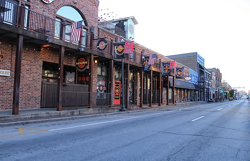 Jonesboro, Arkansas United States - February 13 2022: a bar on a downtown street with flags.