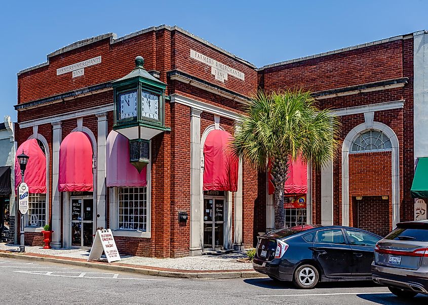 The First Merchants Bank building, circa 1902, featuring a copper and glass clock located in downtown Walterboro, South Carolina.