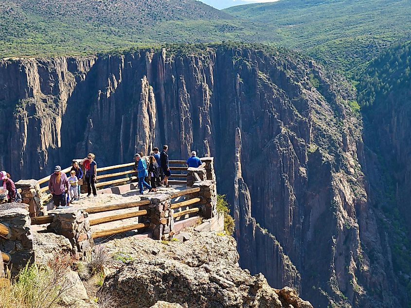 People enjoying view at the Black Canyon of the Gunnison National Park, via Roberto Valz / Shutterstock.com