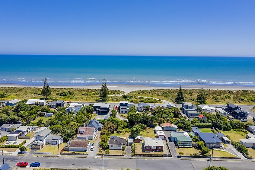 Aerial view of Otaki Beach in New Zealand with waves meeting the shoreline