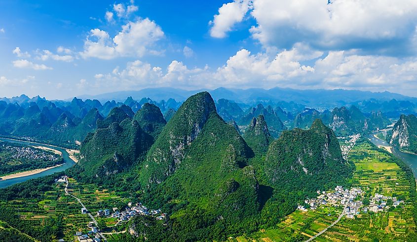 Aerial shot of the spectacular karst mountain with green valley landscape in Guilin, China.