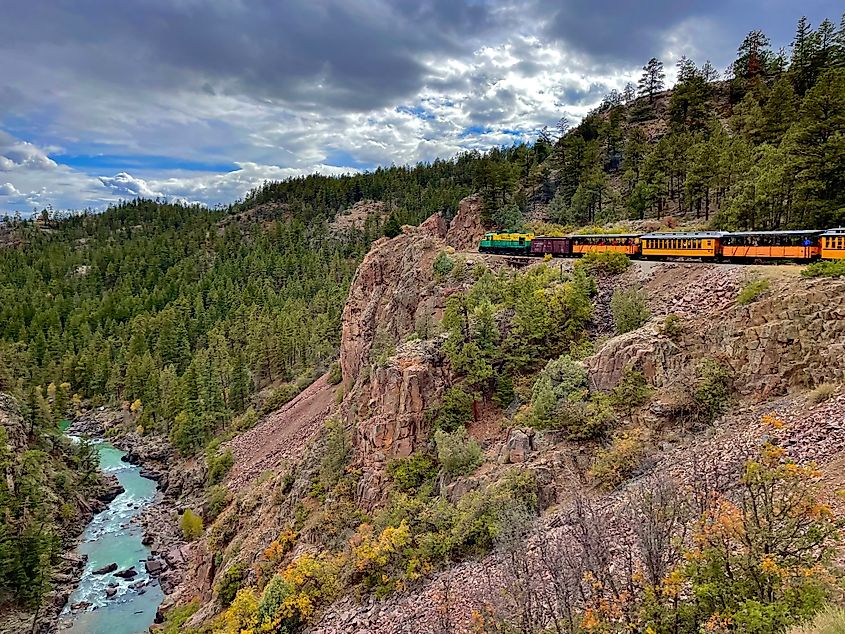 Narrow Gauge Train moving on a cliff from Silverton to Durango, Colorado.