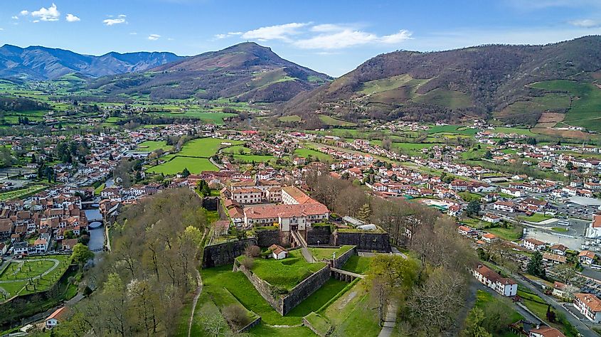 An aerial view of an old French town in the green foothills of the Pyrenees 