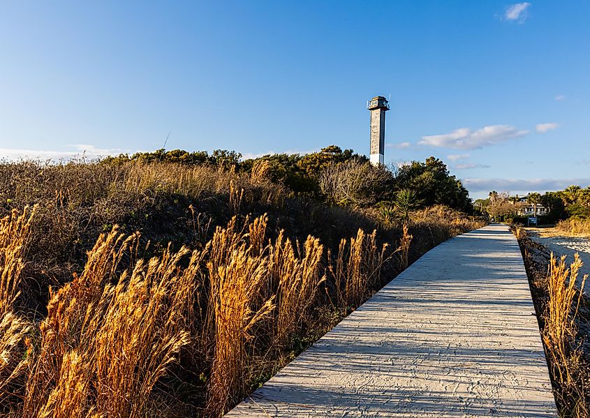 Sand dunes at Station 18 Beach and Sullivan's Island Lighthouse, Sullivan's Island, South Carolina, USA.