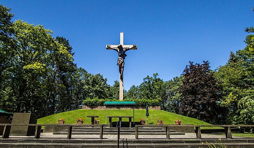 The centerpiece of the Cross In The Woods Shrine in northern Michigan, is the worlds largest wooden crucifix.