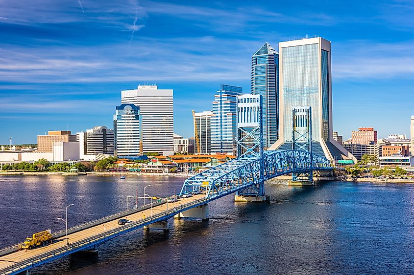 Jacksonville, Florida, USA downtown skyline at dusk over St. Johns River.