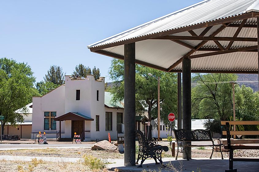 Afternoon sunlight shines on a church and gazebo in the historic downtown core of Patagonia