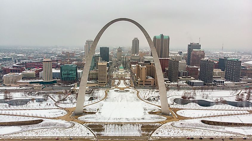 downtown St. Louis covered with snow behind Gateway Arch