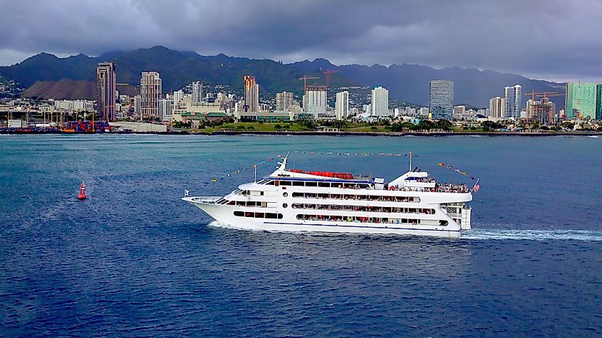 A sunset dinner cruise ship as it enters Honolulu Harbor on Oahu