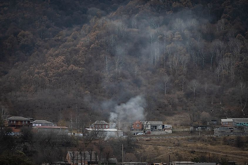 Smoke over a Town by the Forest