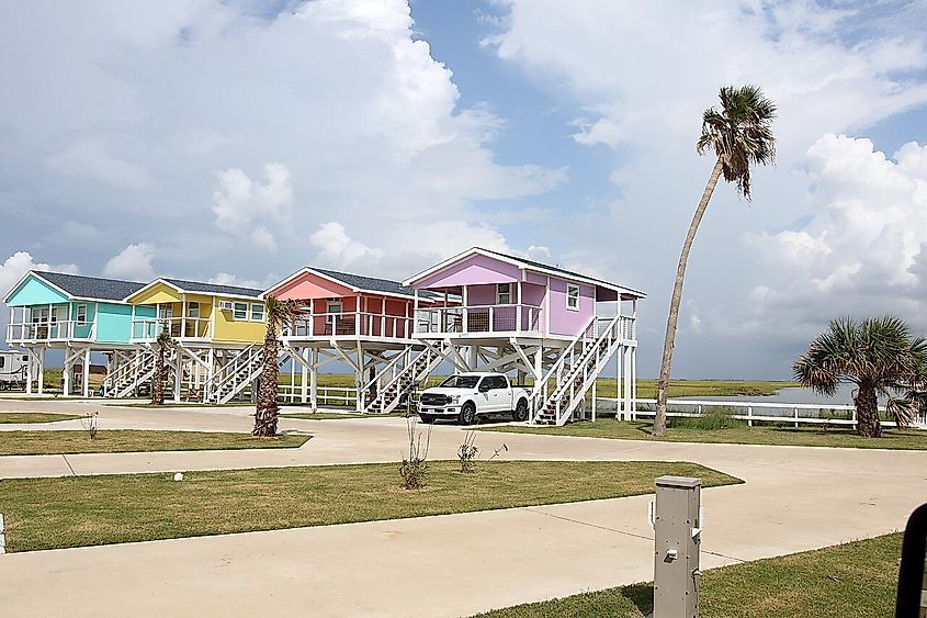 Colorful beach houses and palm trees in Freeport, Texas