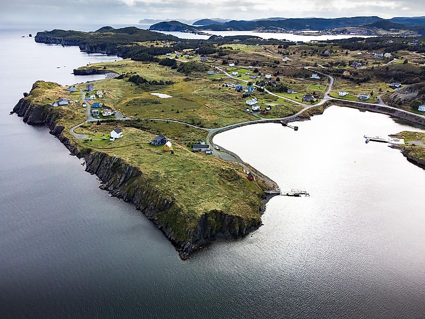 Aerial East Coast and Skerwink trail with small beach homes near Port Rexton Newfoundland Canada