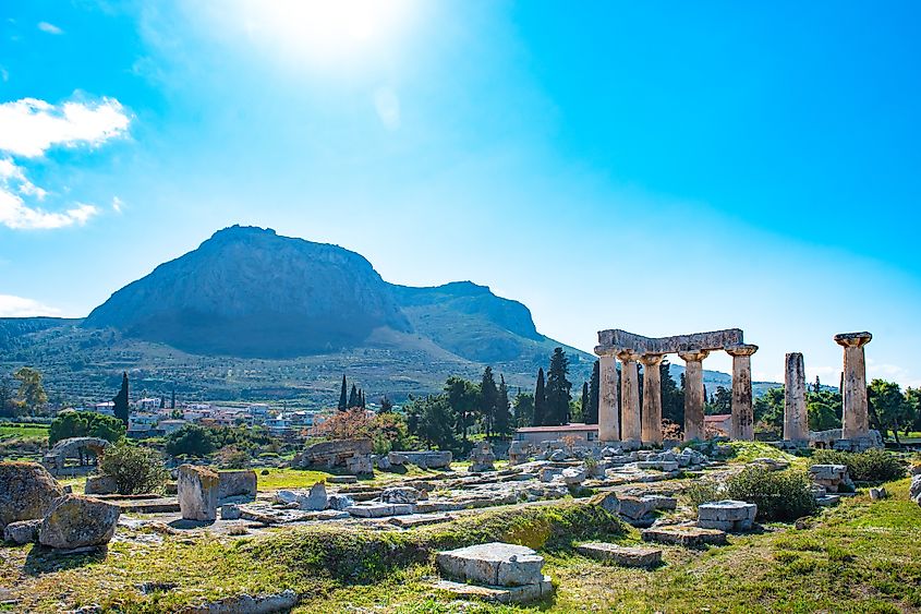 The ruins of the Temple of Apollo and the Acrocorinth fortress in Corinth.