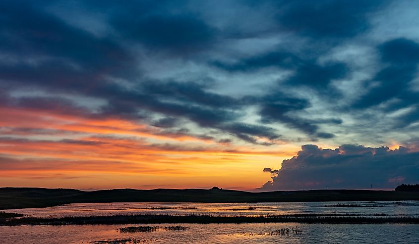 Sunrise clouds over Wetlands at Valentine National Wildlife Refuge in cherry County, Nebraska, USA